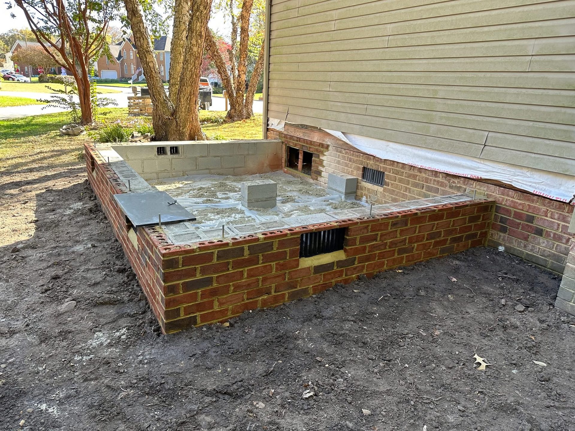Brick foundation for a residential addition under construction